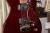 		Musicman - James Valentine Trans Maroon
		